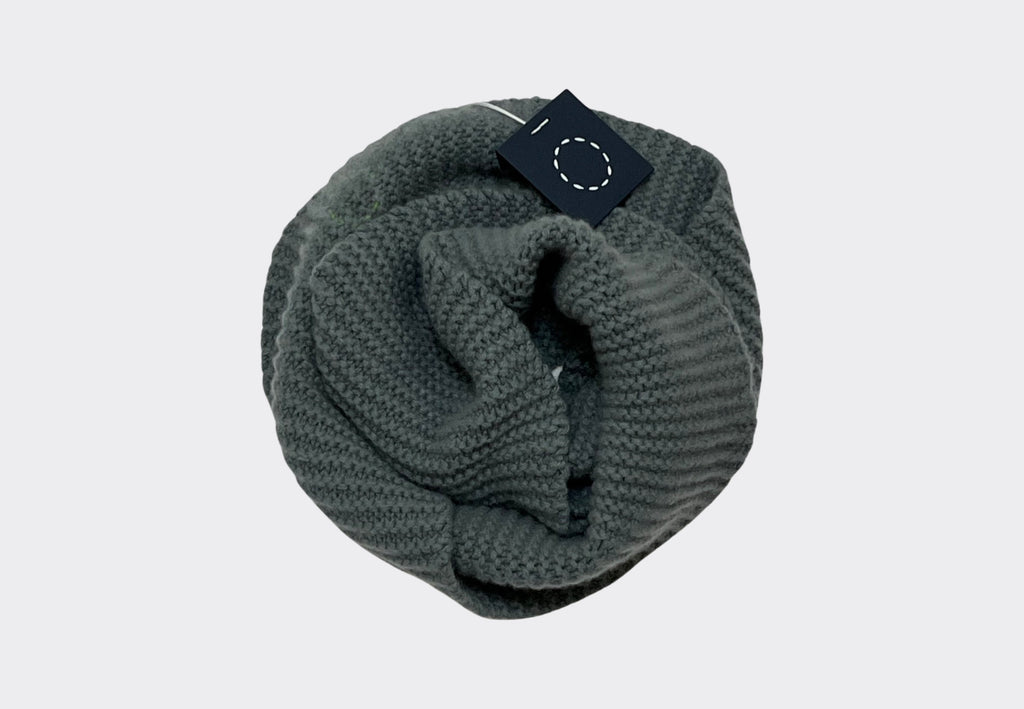 Product shot of grey green coloured chunky textured cashmere tube scarf with Sphere One Irish knitwear brand label navy swing tag