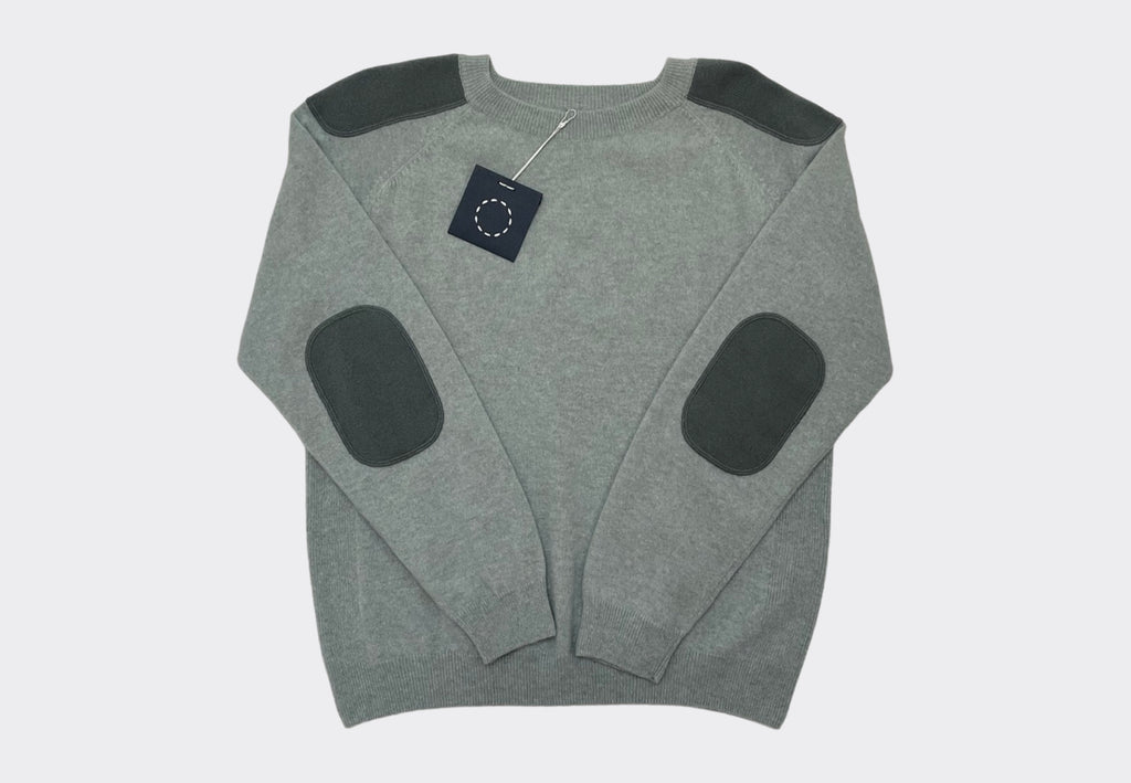 Front product shot midweight round neck cashmere raglan sweater in sage green with tonal green shoulder and elbow patches Irish knitwear design Sphere One