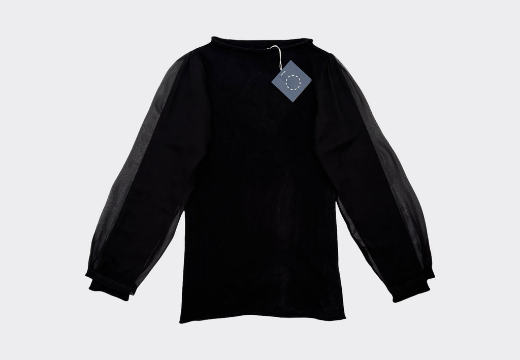 Black hourglass-sleeve cashmere sweater with a Navy swingtag on a light gray background