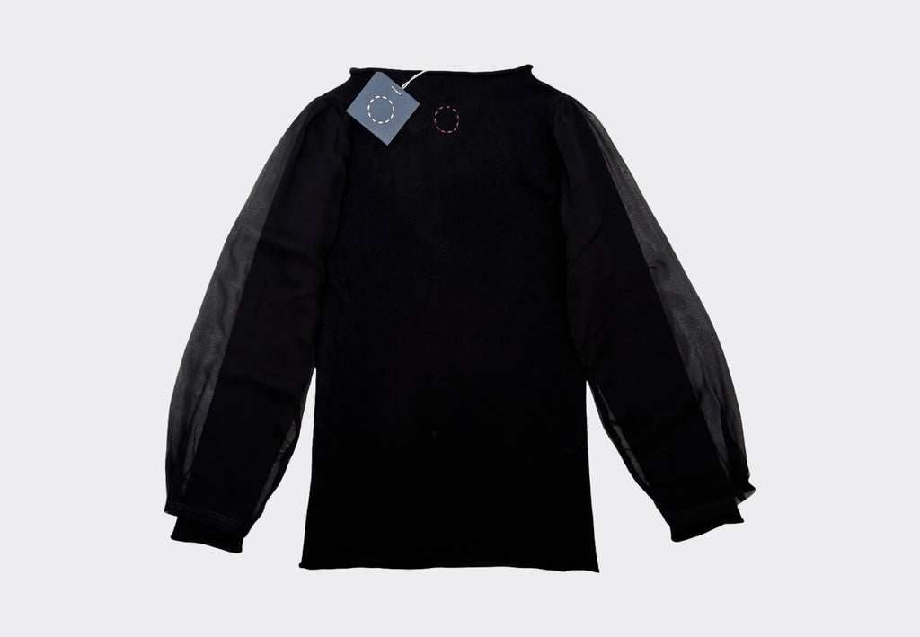 Black hourglass sleeve shirt with transparent chiffon on a light gray background with Sphere One circle of stitches logo