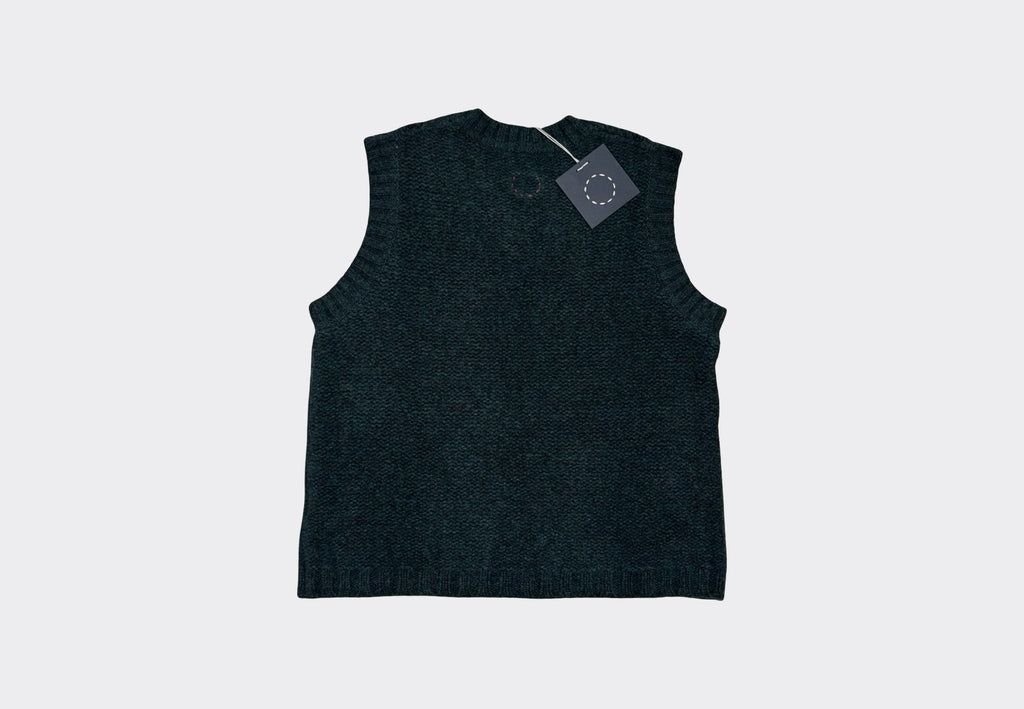 Dark blue grey sleeveless V Neck knit sweater vest on light grey background with navy swing tag