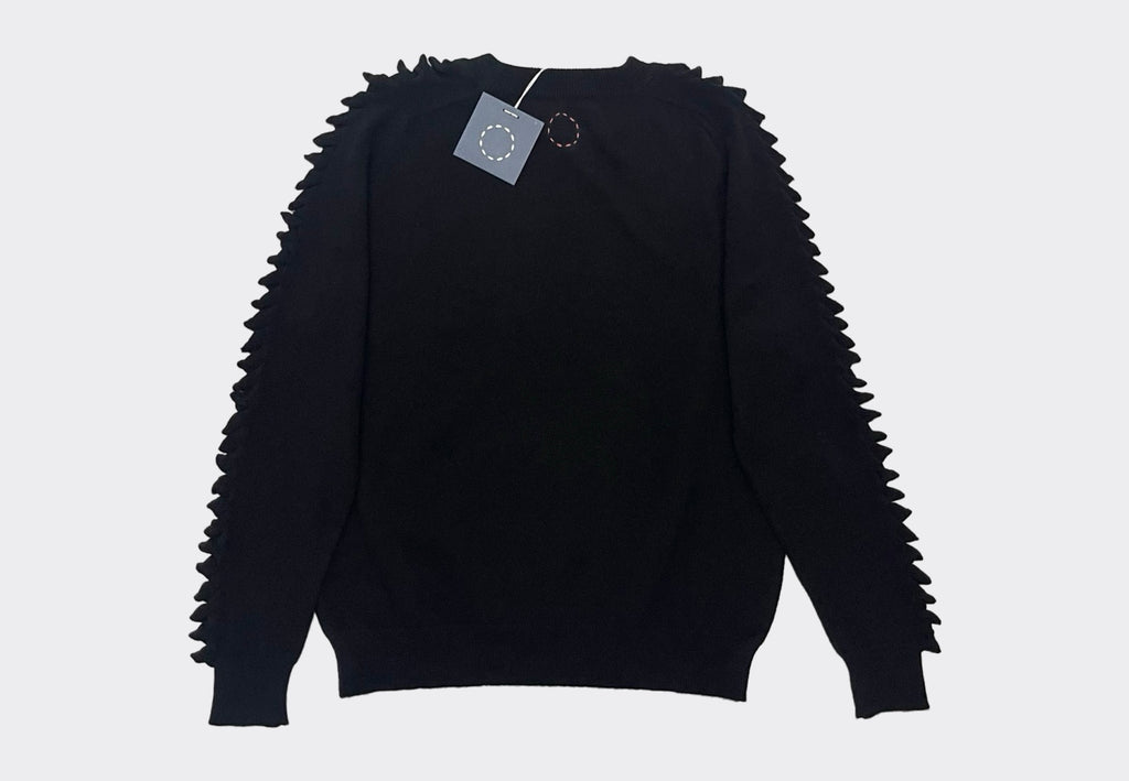 Back product shot round neck black cashmere sweater with raised cashmere stitch on shoulders down the length of the arms.