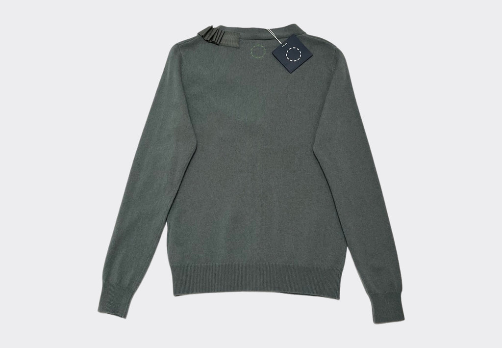 Back product shot of green grey cashmere cardigan with a navy swing label at neck Sphere One Irish knitwear brand