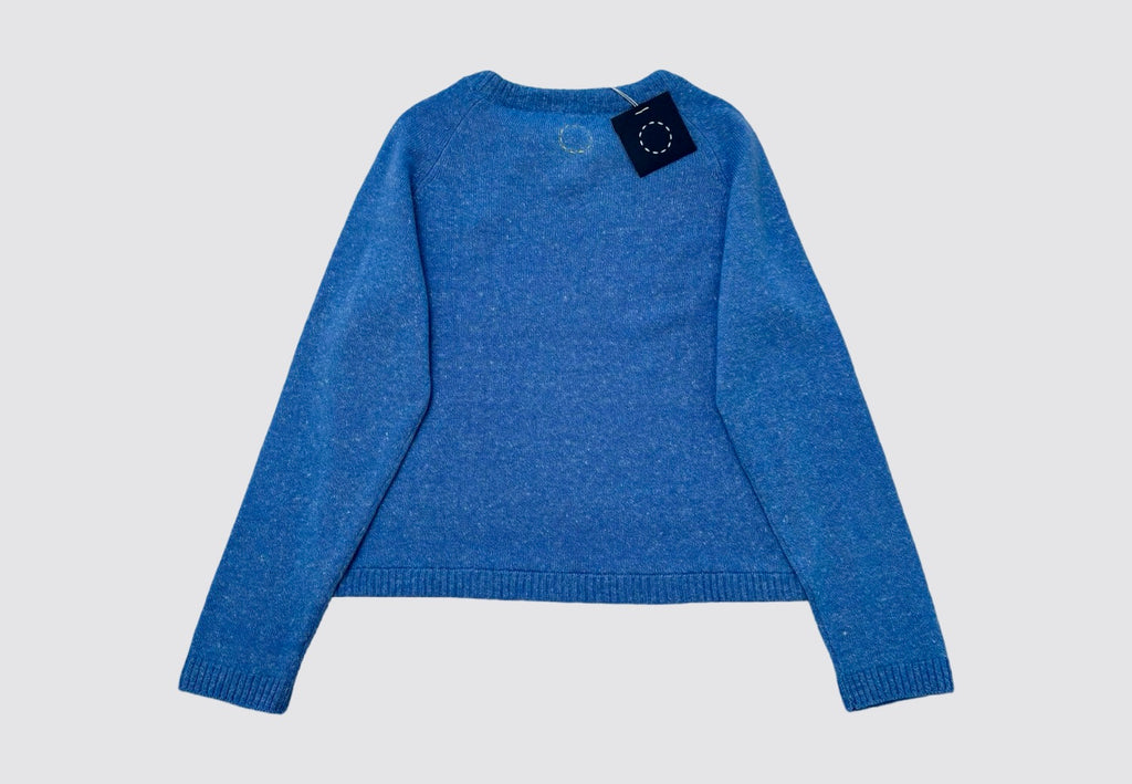 Back product flat lay image of blue round neck drawstring cashmere sweater with swing tag visible and circle of stitches logo from Irish knitwear brand Sphere One